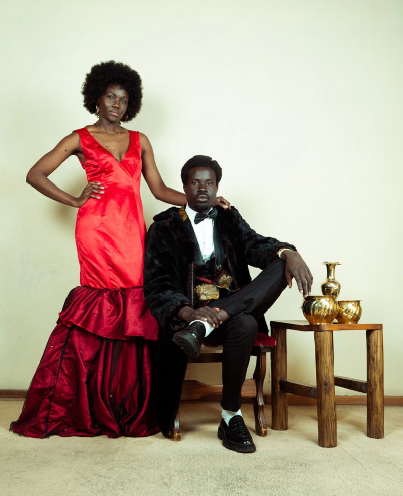 Red gown seated couple portrait