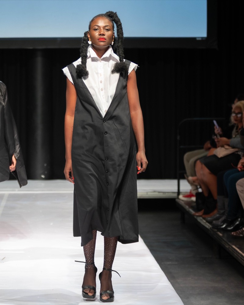 Black vest and white shirt runway