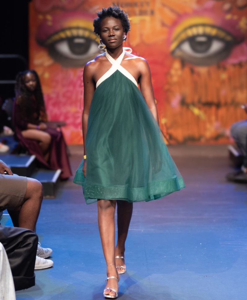Green halter dress on runway