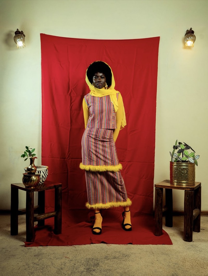 Traditional striped outfit with red backdrop
